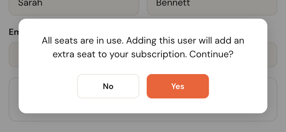 A confirmation dialog warning that adding this user will add an extra seat to the subscription.