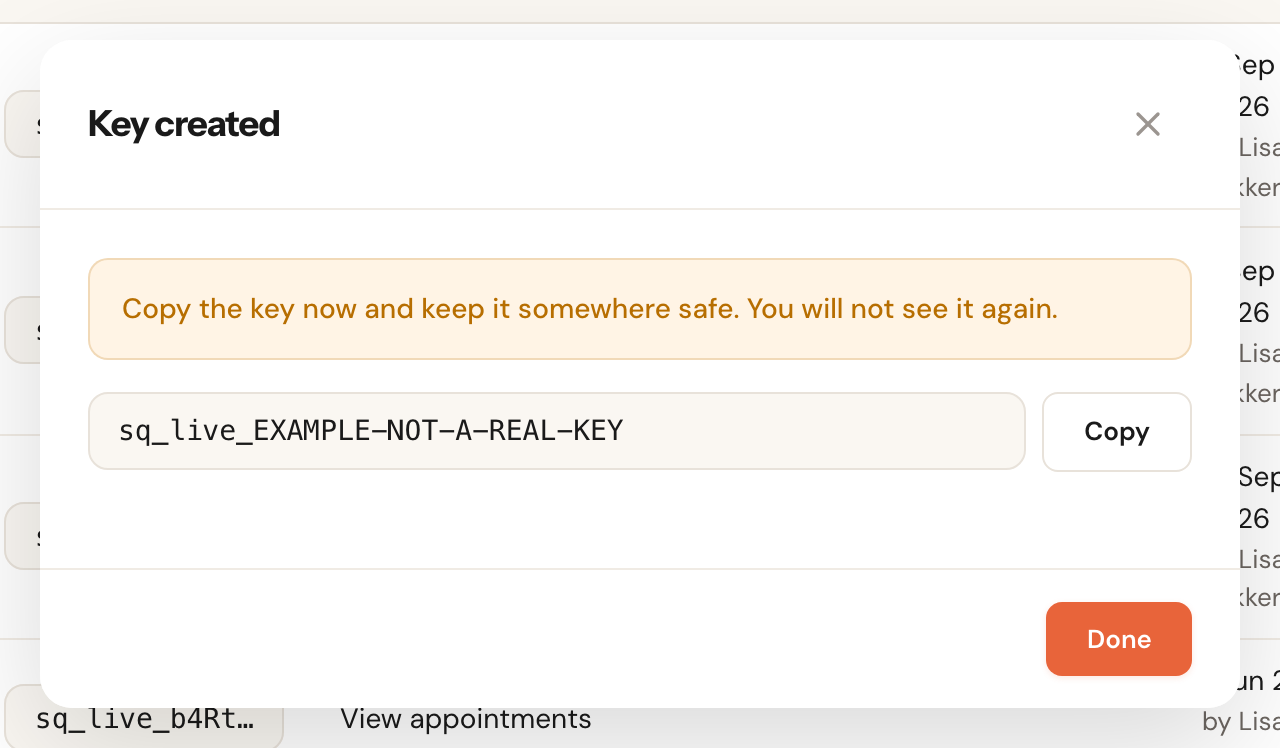 The dialog after Create key, showing the whole example key sq_live_EXAMPLE-NOT-A-REAL-KEY and a button to copy it.