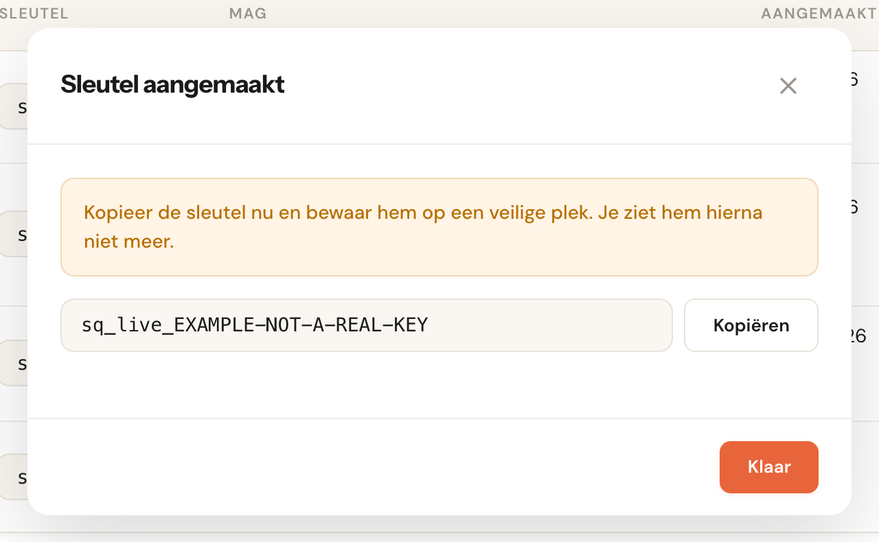 Het venster na Sleutel aanmaken, met de volledige voorbeeldsleutel sq_live_EXAMPLE-NOT-A-REAL-KEY en een knop om hem te kopiëren.