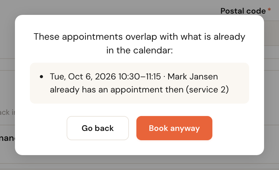 The window These appointments overlap with what is already in the calendar, with one line: Tue, Oct 6, 2026 10:30–11:15, Mark Jansen already has an appointment then (service 2), and the buttons Go back and Book anyway.
