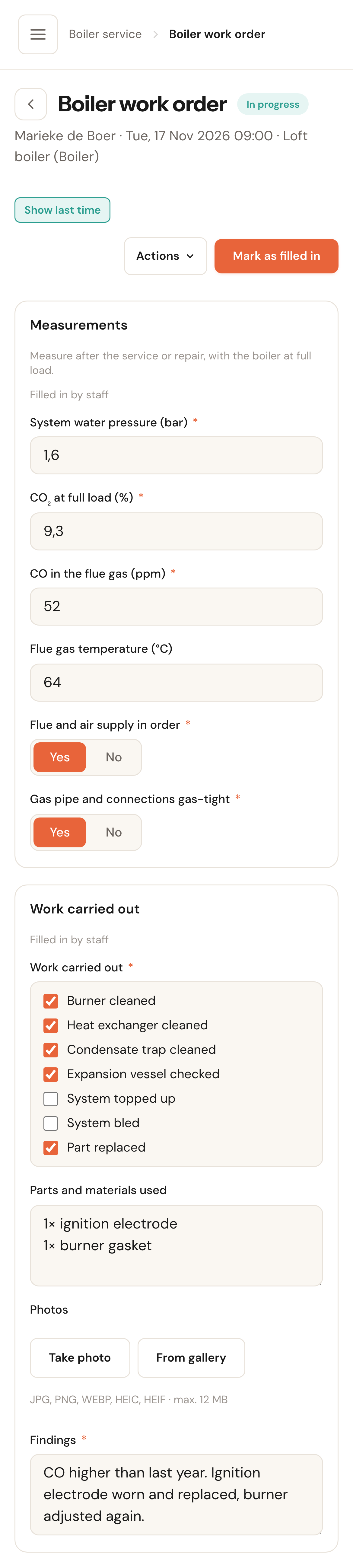 The work order on a phone: the measurements filled in, the work ticked, the parts used, the Take photo and From gallery buttons, and the findings.