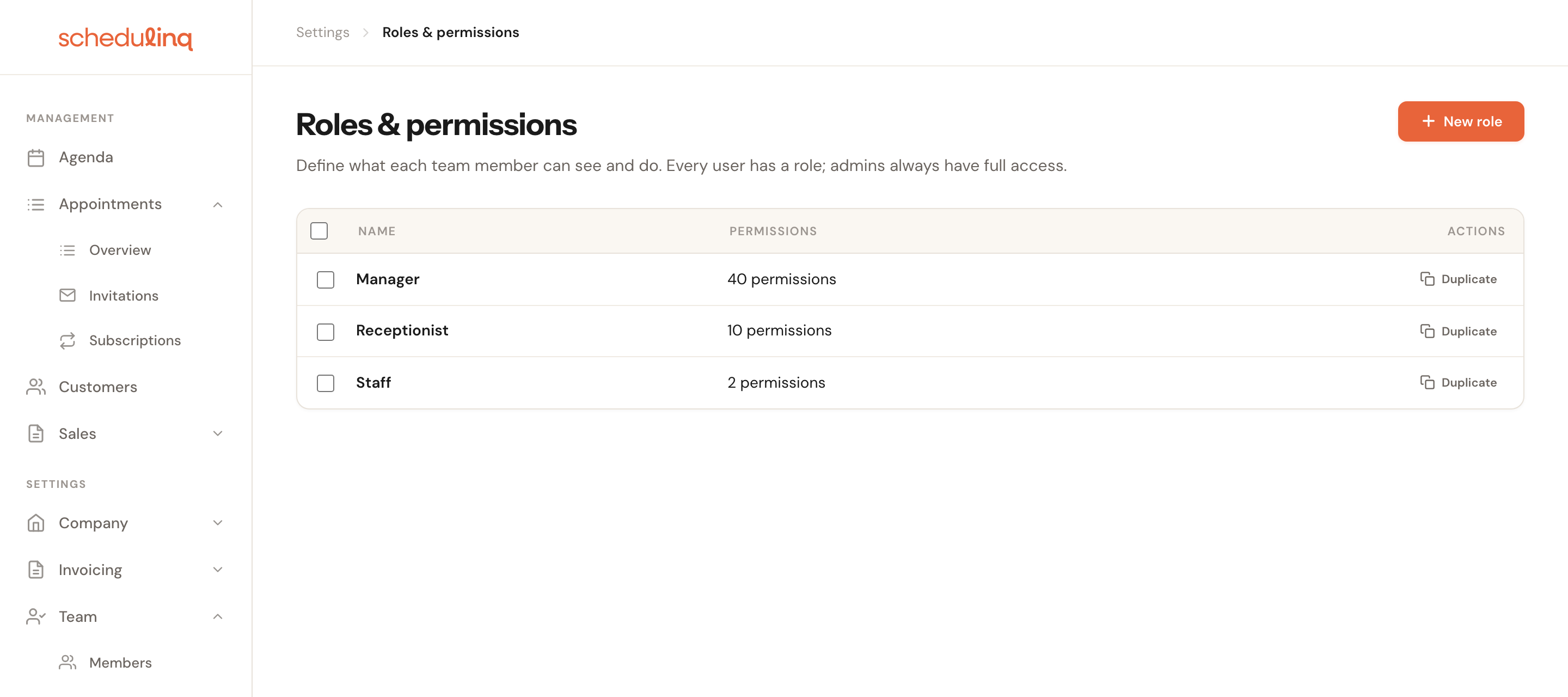 The Roles & permissions page with three roles: Manager, Receptionist and Staff.